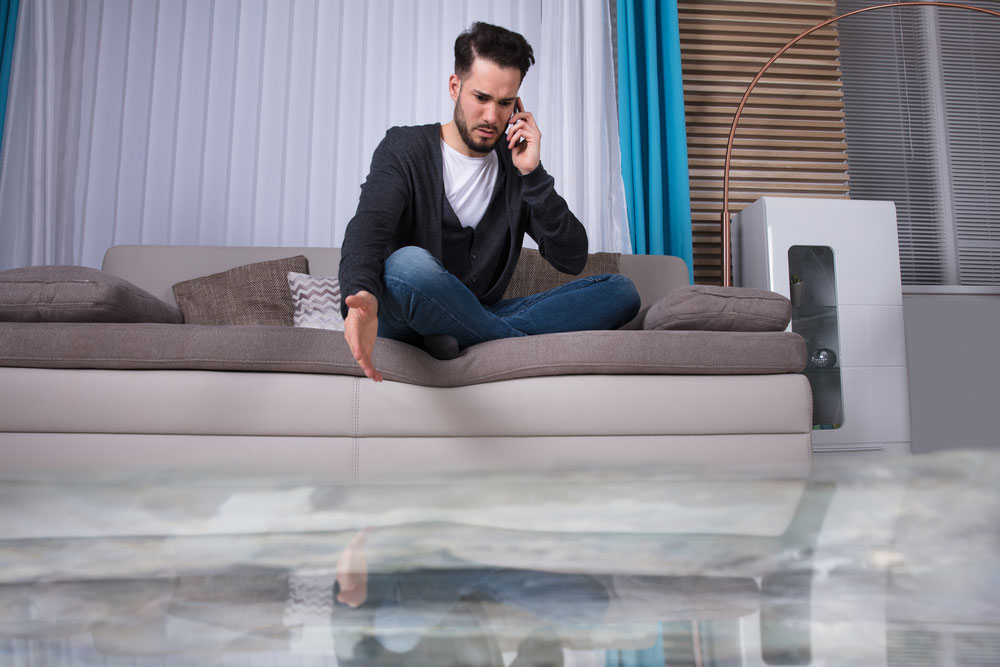 guy with flooded living room